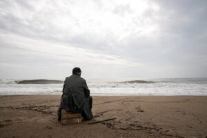 man at the beach feeling depression and anxiety symptoms